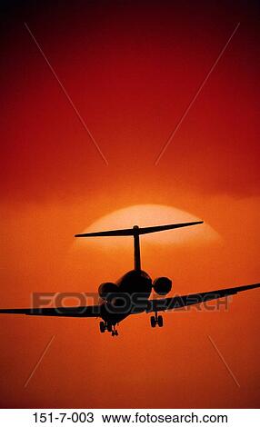 Stock Image - Planes, Transportation, Flight, Airliner, Sunrise, Silhouette, Outside. Fotosearch