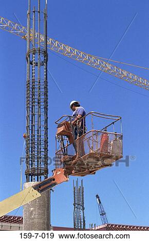 Outdoors, Workman, Construction, Cranes, Construction, Working, Commercial View Large Photo Image Stock Photo - Outdoors, Workman, Construction, Cranes, Construction, Working, Commercial. Fotosearch