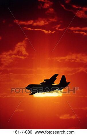 Outdoors, Military, Plane, Clouds, Sun, Air View Large Photo Image Stock Image - Outdoors, Military, Plane, Clouds, Sun, Air. Fotosearch
