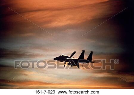 Sunset, Clouds, Aircraft, Flying, Silhouette, USA View Large Photo Image Stock Photo - Sunset, Clouds, Aircraft, Flying, Silhouette, USA. Fotosearch