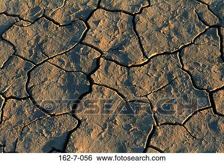 Stock Photograph - Cracked, Cracks, Mud, Textures, Background, Desert. Fotosearch