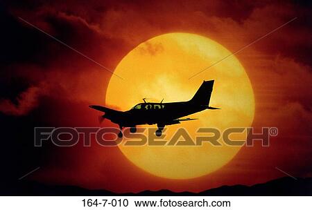 Stock Image - Flying, Aerial, Outdoors, Business, Sunset, Planes, Barron. Fotosearch