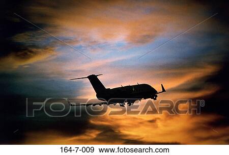 Sunrise, Flying, Business, Aviation, Airplane, Travel, Clouds View Large Photo Image Stock Photo - Sunrise, Flying, Business, Aviation, Airplane, Travel, Clouds. Fotosearch