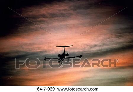 Transport, Outdoors, Aircraft, Day, Flying, Traveling, Silhouette View Large Photo Image Stock Photo - Transport, Outdoors, Aircraft, Day, Flying, Traveling, Silhouette. Fotosearch