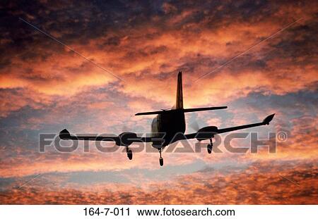 Stock Image - Travelling, Silhouette, Flight, Fly, Jet, Aviation, Transportation. Fotosearch