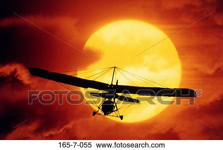 Daylight, Sunset, Aeroplane, Soaring, Clouds, Traveling, Thrill View Large Photo Image Stock Photography - Daylight, Sunset, Aeroplane, Soaring, Clouds, Traveling, Thrill. Fotosearch