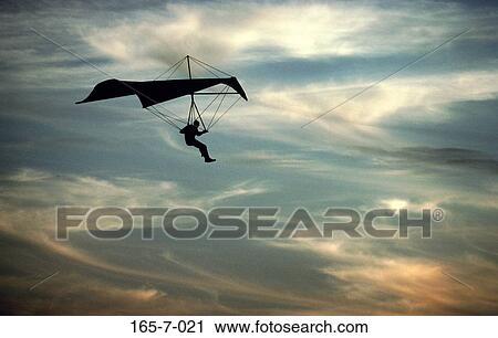 Flight, Silhouette, Thrill, Fly, Outdoors, Thrill, Clouds View Large Photo Image Stock Image - Flight, Silhouette, Thrill, Fly, Outdoors, Thrill, Clouds. Fotosearch