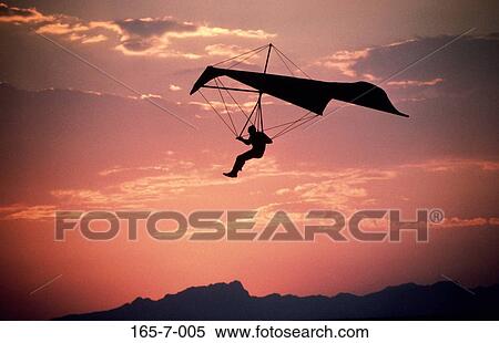 Fly, Recreational, Outdoors, Sunrise, Soaring, Adventure, Hanglider View Large Photo Image Stock Photography - Fly, Recreational, Outdoors, Sunrise, Soaring, Adventure, Hanglider. Fotosearch