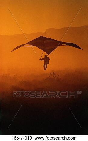 Landing, Hanglider, Recreation, Recreational, Sunset, Glider, Outside View Large Photo Image Stock Photo - Landing, Hanglider, Recreation, Recreational, Sunset, Glider, Outside. Fotosearch