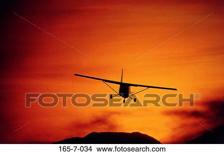 Recreation, Flight, Plane, Silhouette, Sunrise, Aviation, Outside View Large Photo Image Picture - Recreation, Flight, Plane, Silhouette, Sunrise, Aviation, Outside. Fotosearch