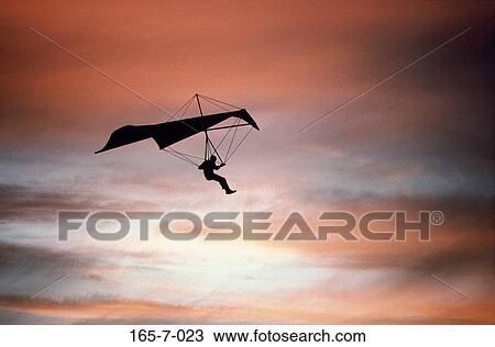 Recreational, Silhouette, Outdoors, Aerial, Cloud, Glider, Clouds View Large Photo Image Stock Image - Recreational, Silhouette, Outdoors, Aerial, Cloud, Glider, Clouds. Fotosearch
