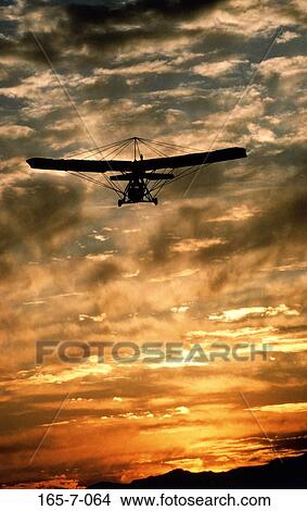 Ultralight, Thrilling, Aviation, Silhouette, Airplane, Sunset, Day View Large Photo Image Picture - Ultralight, Thrilling, Aviation, Silhouette, Airplane, Sunset, Day. Fotosearch