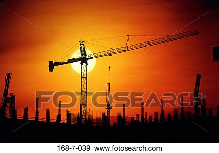 Cranes, Equipment, Silhouette, Sunrise, Construction, Industrial, Day View Large Photo Image Stock Photo - Cranes, Equipment, Silhouette, Sunrise, Construction, Industrial, Day. Fotosearch