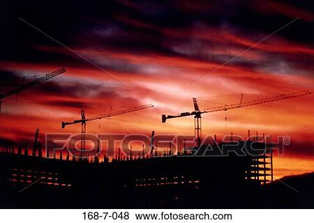 Equipment, Crane, Sunrise, Outdoors, Silhouette, Industry, Construction View Large Photo Image Stock Photo - Equipment, Crane, Sunrise, Outdoors, Silhouette, Industry, Construction. Fotosearch