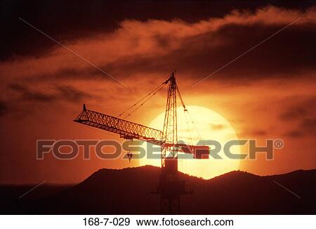 Outdoors, Cranes, Silhouette, Building, Crane, Sunset, Construction View Large Photo Image Stock Photo - Outdoors, Cranes, Silhouette, Building, Crane, Sunset, Construction. Fotosearch