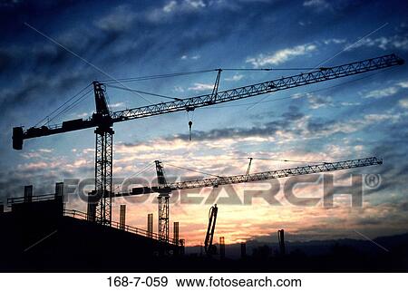 Sunset, Outside, Cranes, Frame, Building, Silhouette, Industrial View Large Photo Image Stock Photo - Sunset, Outside, Cranes, Frame, Building, Silhouette, Industrial. Fotosearch