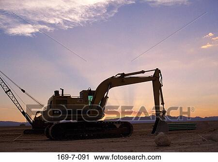 Stock Image - Commercial, Outdoors, Earth, Dirt, Sunset, Outside, Equipment. Fotosearch