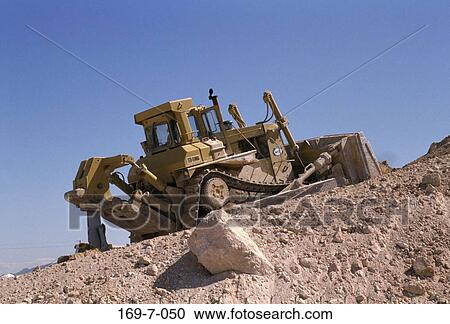 Stock Image - Commercial, Outside, Outdoors, Equipment, Earth, Daylight, Heavy. Fotosearch