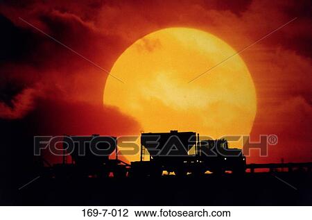 Stock Image - Heavy, Macinery, Daylight, Sunset, Construction, Work, Moving. Fotosearch