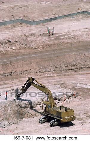 Stock Image - Macinery, Earth, Earth, Dirt, Workers, Daylight, Outdoors. Fotosearch