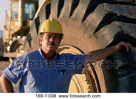 Outdoors, Moving, Hat, Construction, Earth, Workman, Workers View Large Photo Image Stock Photo - Outdoors, Moving, Hat, Construction, Earth, Workman, Workers. Fotosearch