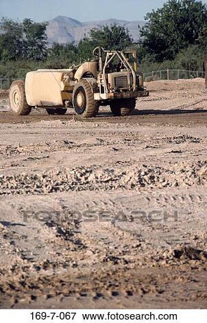 Stock Photo - Site, Earth, Commercial, Equipment, Building, Daylight, Moving. Fotosearch
