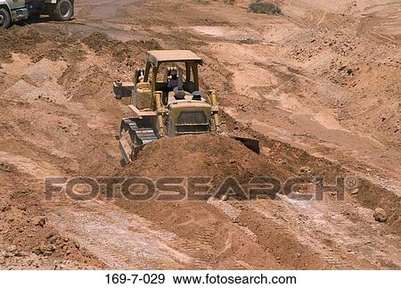 Stock Photo - Work, Heavy, Construction, Macinery, Moving, Outdoors, Moving. Fotosearch