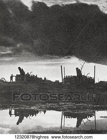 Stock Photograph - 9. 2 inch battery of howitzers awaiting an order at Birr Cross Roads, Ypres, during Octoberr 1917. From the magazine Twenty Years After The Battlefields of 1914-1918 Then and Now by Sir Ernest Swinton published 1938.. Fotosearch