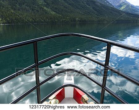 Stock Photograph - A boat on Upper Waterton Lake, Waterton Lakes National Park; Alberta, Canada. Fotosearch