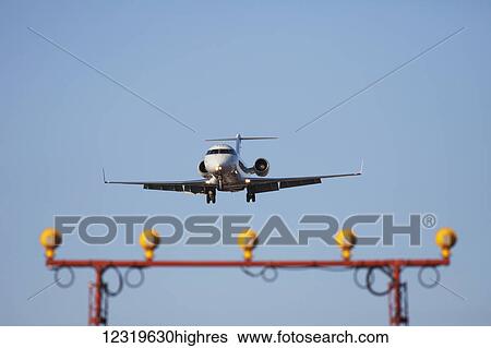 Stock Photograph - A Bombardier CRJ-100 Regional Jet on approach to Lester B. Pearson International Airport; Mississauga, Ontario, Canada. Fotosearch