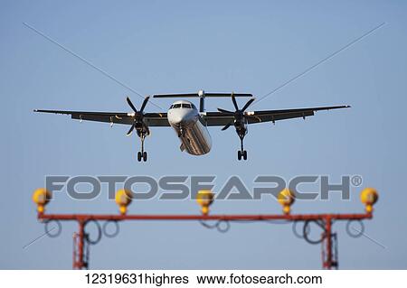 Stock Photograph - A Bombardier Dash 8 turboprop aircraft on approach to Lester B. Pearson International Airport; Mississauga, Ontario, Canada. Fotosearch