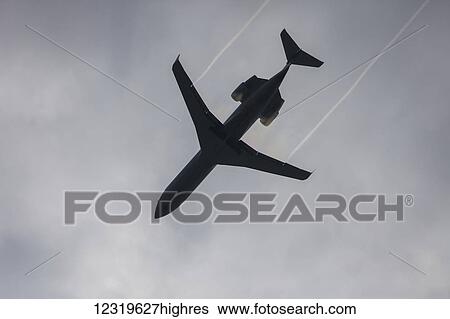 A Bombardier Regional Jet on approach to Lester B. Pearson International Airport passes through mist over Brampton, Ontario; Brampton, Ontario, Canada View Large Photo Image Stock Photograph - A Bombardier Regional Jet on approach to Lester B. Pearson International Airport passes through mist over Brampton, Ontario; Brampton, Ontario, Canada. Fotosearch