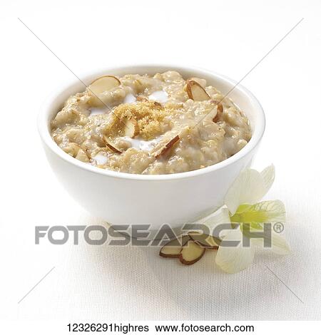 Stock Photograph - A bowl of oatmeal with almonds. Fotosearch