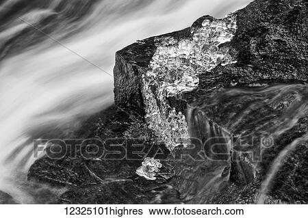 A brook flowing out of Hobsons Lake with ice on the wet rock, Birch Cove Lakes Wilderness; Bedford, Nova Scotia, Canada View Large Photo Image Stock Photograph - A brook flowing out of Hobsons Lake with ice on the wet rock, Birch Cove Lakes Wilderness; Bedford, Nova Scotia, Canada. Fotosearch
