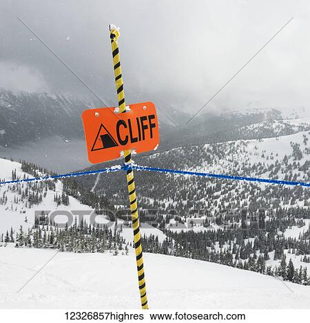 A caution sign at a ski resort warning of a cliff; Whistler, British Columbia, Canada View Large Photo Image Stock Photograph - A caution sign at a ski resort warning of a cliff; Whistler, British Columbia, Canada. Fotosearch