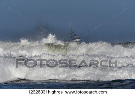 A commercial fishing boat works near the surf on the Oregon Coast; Newport, Oregon, United States of America View Large Photo Image Stock Photograph - A commercial fishing boat works near the surf on the Oregon Coast; Newport, Oregon, United States of America. Fotosearch