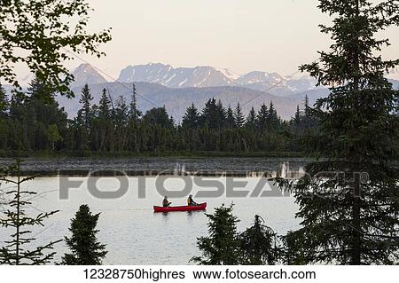 A couple canoeing on Stone Step Lake; Homer, Alaska, United States of America View Large Photo Image Stock Photograph - A couple canoeing on Stone Step Lake; Homer, Alaska, United States of America. Fotosearch