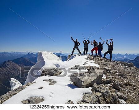 A family creating a funny pose while hiking in the Rocky Mountains; Banff, Alberta, Canada View Large Photo Image Stock Photograph - A family creating a funny pose while hiking in the Rocky Mountains; Banff, Alberta, Canada. Fotosearch
