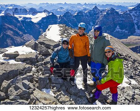A family posing while hiking in the Rocky Mountains; Banff, Alberta, Canada View Large Photo Image Stock Photograph - A family posing while hiking in the Rocky Mountains; Banff, Alberta, Canada. Fotosearch