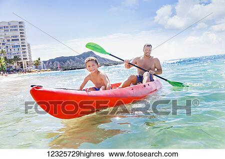 A father and son spending time kayaking together off of Waikiki beach,; Honolulu, Oahu, Hawaii, United States of America View Large Photo Image Stock Photograph - A father and son spending time kayaking together off of Waikiki beach,; Honolulu, Oahu, Hawaii, United States of America. Fotosearch