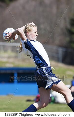 A girl throws a soccer ball over her head into the game from the sidelines; Homer, Alaska, United States of America View Large Photo Image Stock Photograph - A girl throws a soccer ball over her head into the game from the sidelines; Homer, Alaska, United States of America. Fotosearch
