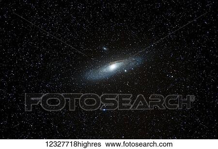 Stock Photograph - A glowing planet in a dark sky with stars; South Shields, Tyne and Wear, England. Fotosearch