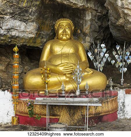 Stock Photograph - A golden buddha statue; Luang Prabang, Luang Prabang Province, Laos. Fotosearch