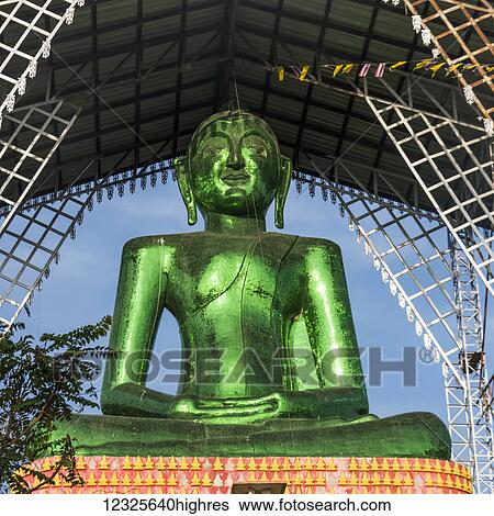 A green buddha statue, Phrathat Doi Ha Chedi; Tambon Si Don Chai, Chang Wat Chiang Rai, Thailand View Large Photo Image Stock Photograph - A green buddha statue, Phrathat Doi Ha Chedi; Tambon Si Don Chai, Chang Wat Chiang Rai, Thailand. Fotosearch