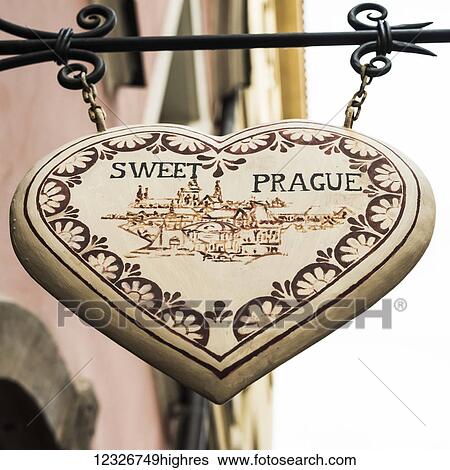 A heart shaped sign hanging from a building saying 'Sweet Prague'; Prague, Czechia View Large Photo Image Stock Photograph - A heart shaped sign hanging from a building saying 'Sweet Prague'; Prague, Czechia. Fotosearch