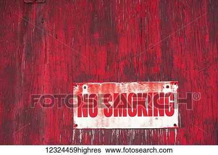 A no smoking sign on a painted red wooden wall; Orion, Alberta, Canada View Large Photo Image Stock Photograph - A no smoking sign on a painted red wooden wall; Orion, Alberta, Canada. Fotosearch