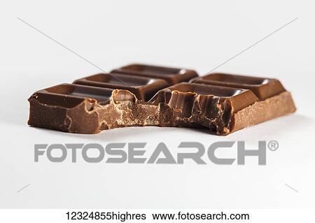 A piece of chocolate bar with a bite out of the corner; Ontario, Canada View Large Photo Image Stock Photograph - A piece of chocolate bar with a bite out of the corner; Ontario, Canada. Fotosearch