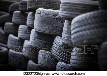 Stock Photograph - A pile of old, worn tires; Regina, Saskatchewan, Canada. Fotosearch