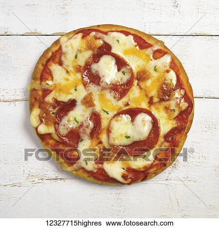 A pizza with melted cheese and pepperoni on a white wooden surface View Large Photo Image Stock Photograph - A pizza with melted cheese and pepperoni on a white wooden surface. Fotosearch