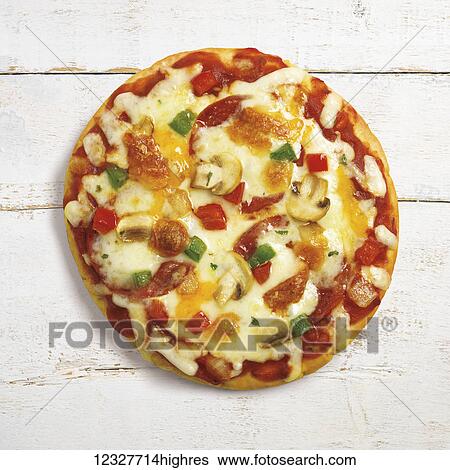 A pizza with melted cheese, peppers and mushrooms on a white wooden surface View Large Photo Image Stock Photograph - A pizza with melted cheese, peppers and mushrooms on a white wooden surface. Fotosearch